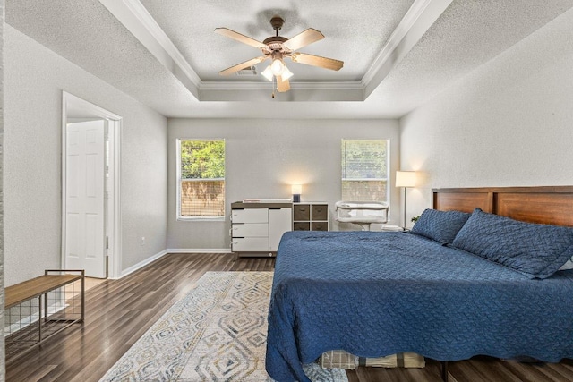 5302 Oster Dr, Killeen, TX 76542 - bedroom with a tray ceiling, crown molding, wood finished floors, a ceiling fan, and a textured ceiling