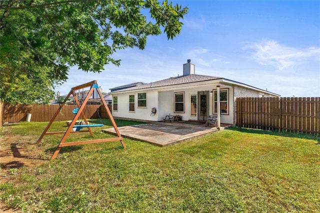 5302 Oster Dr, Killeen, TX 76542 - back of property featuring a playground, a patio area, a fenced backyard, and a chimney