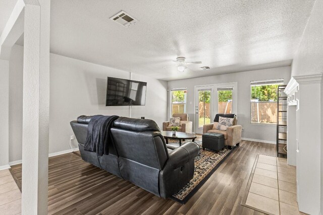 5302 Oster Dr, Killeen, TX 76542 - living room with ceiling fan, wood finished floors, and a textured ceiling