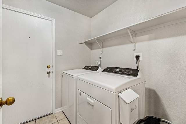 5302 Oster Dr, Killeen, TX 76542 - laundry area with separate washer and dryer and light tile patterned flooring