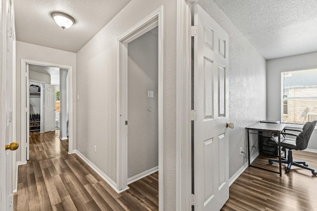 5302 Oster Dr, Killeen, TX 76542 - corridor with dark wood finished floors, a textured ceiling, a textured wall, and an office area