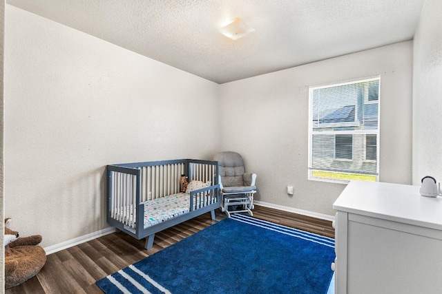 5302 Oster Dr, Killeen, TX 76542 - bedroom featuring wood finished floors and baseboards