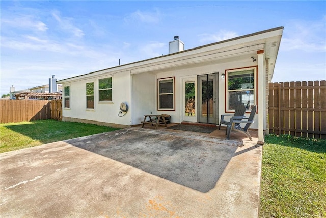 5302 Oster Dr, Killeen, TX 76542 - rear view of house featuring a fenced backyard, a patio, and a chimney
