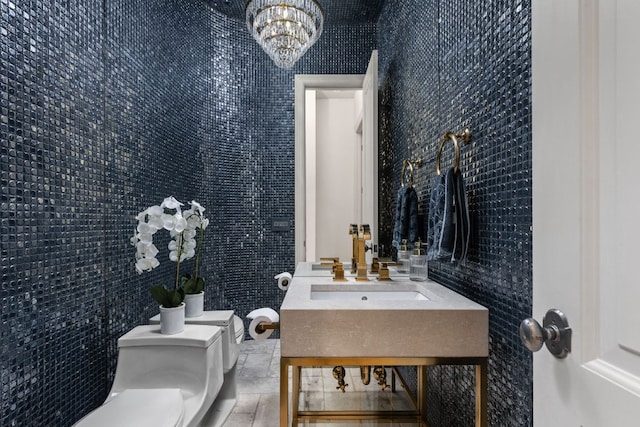 8634 Navidad Dr, Austin, TX 78735 - half bathroom with toilet and a chandelier