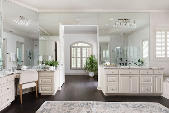 8634 Navidad Dr, Austin, TX 78735 - full bath with ornamental molding, tiled shower, vanity, wood finished floors, and plenty of natural light