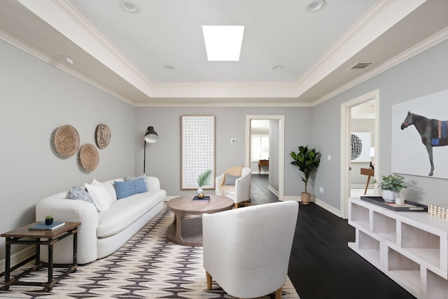8634 Navidad Dr, Austin, TX 78735 - living area featuring a tray ceiling, crown molding, wood finished floors, and a skylight