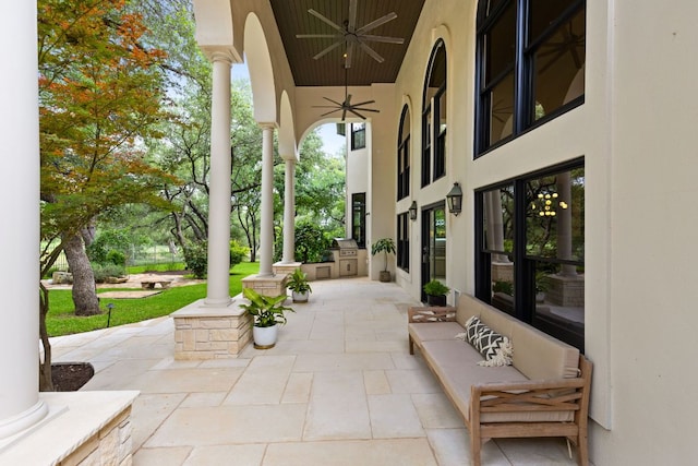 8634 Navidad Dr, Austin, TX 78735 - view of patio with a ceiling fan and exterior kitchen