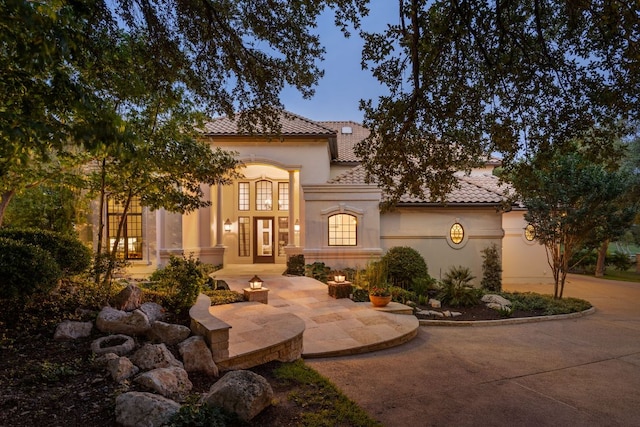 8634 Navidad Dr, Austin, TX 78735 - mediterranean / spanish house with stucco siding and a tiled roof