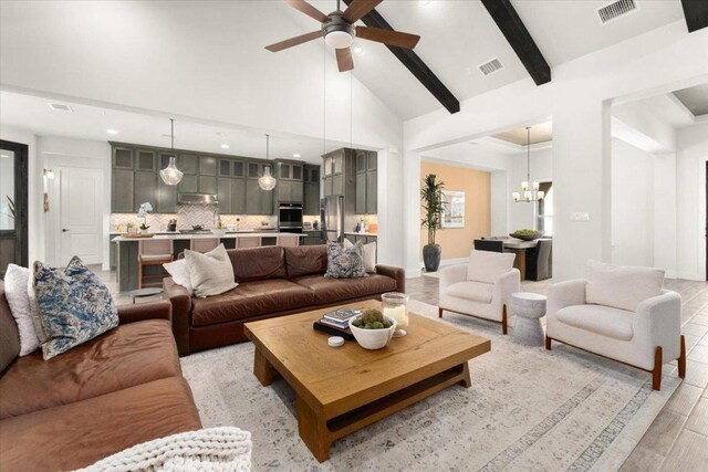 230 Wilderness Cv, Driftwood, TX 78619 - living area with a chandelier, high vaulted ceiling, a ceiling fan, recessed lighting, and beamed ceiling