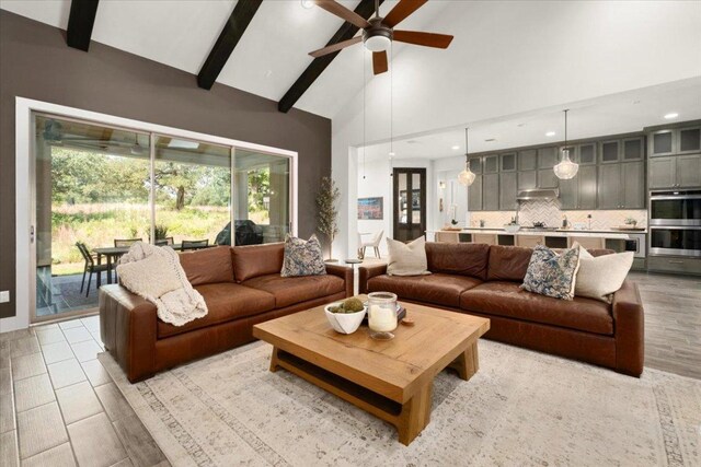 230 Wilderness Cv, Driftwood, TX 78619 - living area with a ceiling fan, high vaulted ceiling, beamed ceiling, and recessed lighting