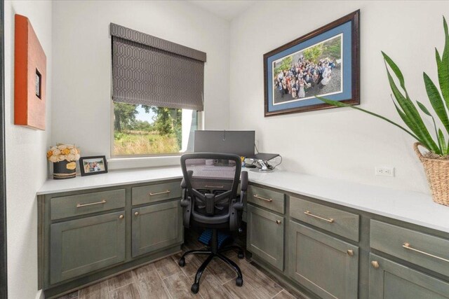 230 Wilderness Cv, Driftwood, TX 78619 - office area with built in desk and wood finished floors