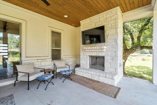 230 Wilderness Cv, Driftwood, TX 78619 - view of patio with an outdoor living space with a fireplace