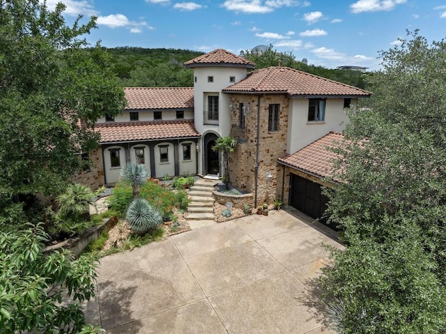 3816 Pappys Way, Austin, TX 78730 - mediterranean / spanish-style home featuring a tiled roof, concrete driveway, and stucco siding