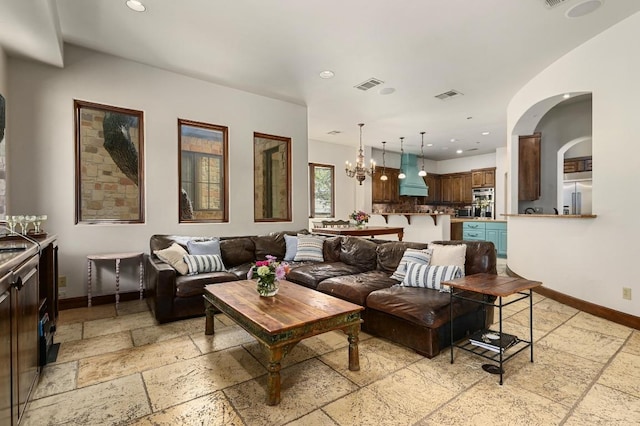3816 Pappys Way, Austin, TX 78730 - living area featuring stone tile flooring, recessed lighting, and a chandelier