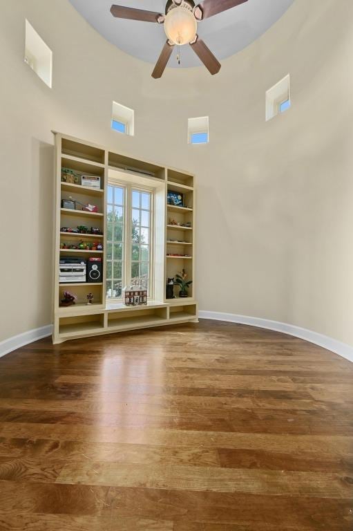 3816 Pappys Way, Austin, TX 78730 - empty room featuring wood finished floors, a ceiling fan, and a high ceiling