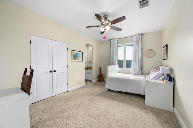 3816 Pappys Way, Austin, TX 78730 - bedroom with carpet flooring, arched walkways, a ceiling fan, and a closet