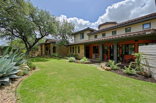 3816 Pappys Way, Austin, TX 78730 - back of property with a lawn, a tiled roof, and stucco siding