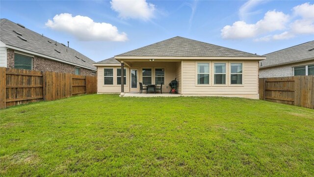 687 Oleander Loop, Buda, TX 78610 - rear view of house featuring a patio, a fenced backyard, and roof with shingles