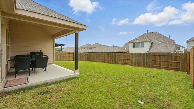 687 Oleander Loop, Buda, TX 78610 - fenced backyard featuring a patio area