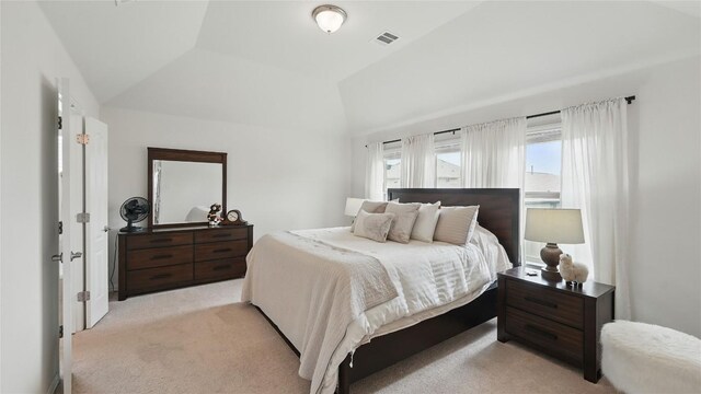 687 Oleander Loop, Buda, TX 78610 - bedroom with light colored carpet and lofted ceiling