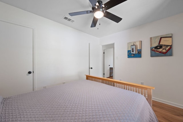 2801 Cornish Cir, Austin, TX 78745 - bedroom with wood finished floors and ceiling fan