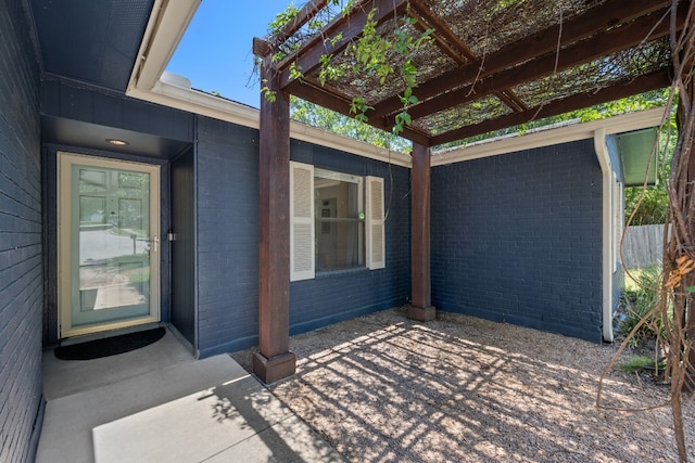 2801 Cornish Cir, Austin, TX 78745 - property entrance with a pergola and brick siding