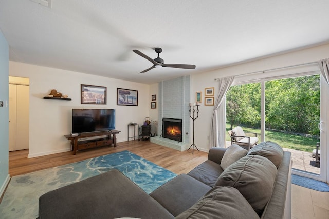 2801 Cornish Cir, Austin, TX 78745 - living area featuring wood finished floors, ceiling fan, and a fireplace