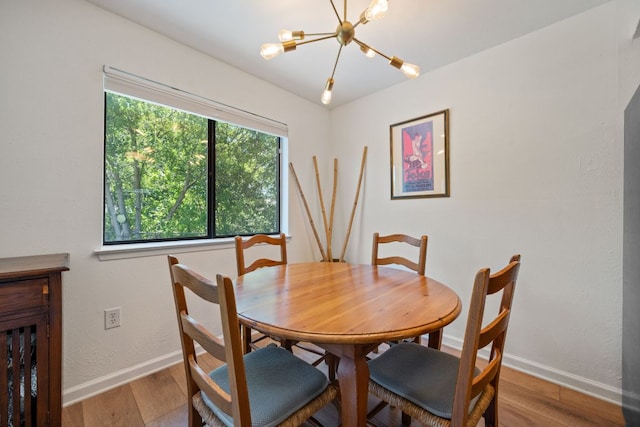 2801 Cornish Cir, Austin, TX 78745 - dining space with a chandelier and wood finished floors
