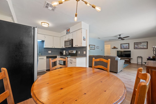2801 Cornish Cir, Austin, TX 78745 - dining space with ceiling fan and light wood-type flooring