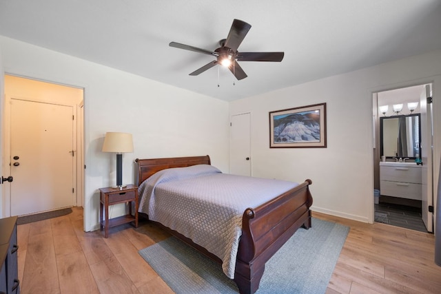 2801 Cornish Cir, Austin, TX 78745 - bedroom featuring light wood-style flooring, connected bathroom, and ceiling fan