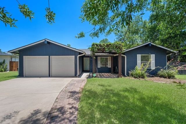 2801 Cornish Cir, Austin, TX 78745 - ranch-style house with an attached garage, driveway, a front lawn, and brick siding