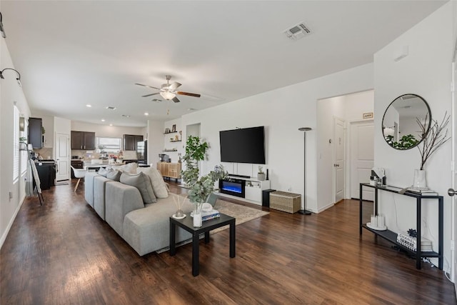 7304 Fall Ray Dr, Del Valle, TX 78617 - living area with a ceiling fan, dark wood-style flooring, and recessed lighting