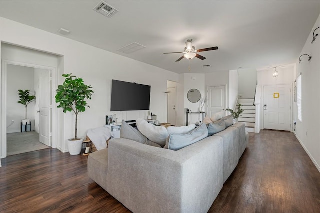 7304 Fall Ray Dr, Del Valle, TX 78617 - living area with dark wood finished floors, ceiling fan, and stairway