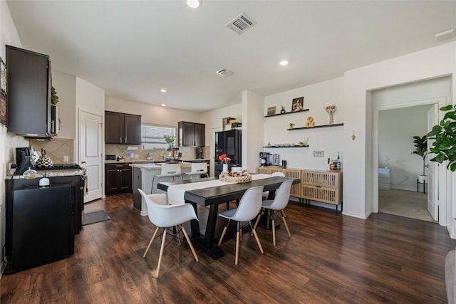 7304 Fall Ray Dr, Del Valle, TX 78617 - dining space featuring dark wood-style flooring and recessed lighting