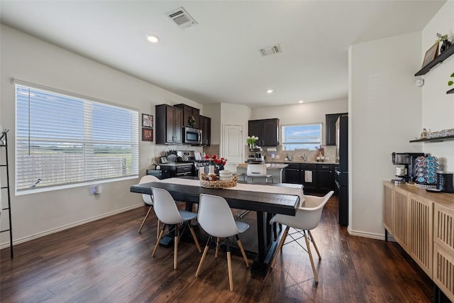 7304 Fall Ray Dr, Del Valle, TX 78617 - dining area featuring dark wood-type flooring and recessed lighting