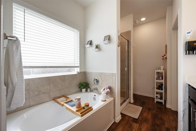 7304 Fall Ray Dr, Del Valle, TX 78617 - full bath with a bath, vanity, a shower stall, and wood finished floors