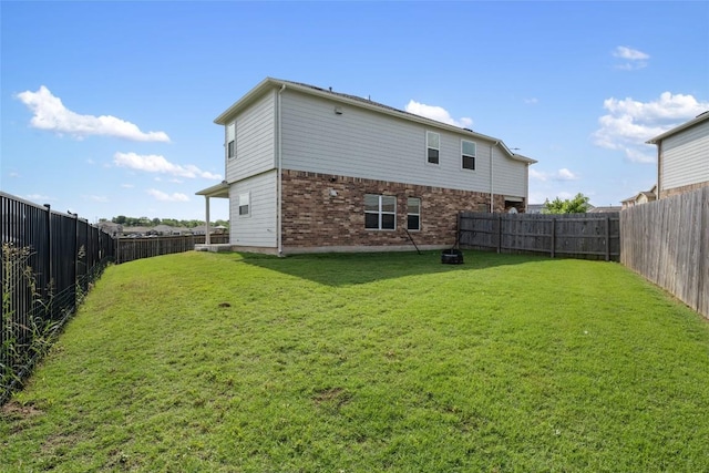 7304 Fall Ray Dr, Del Valle, TX 78617 - back of property featuring a fenced backyard and brick siding