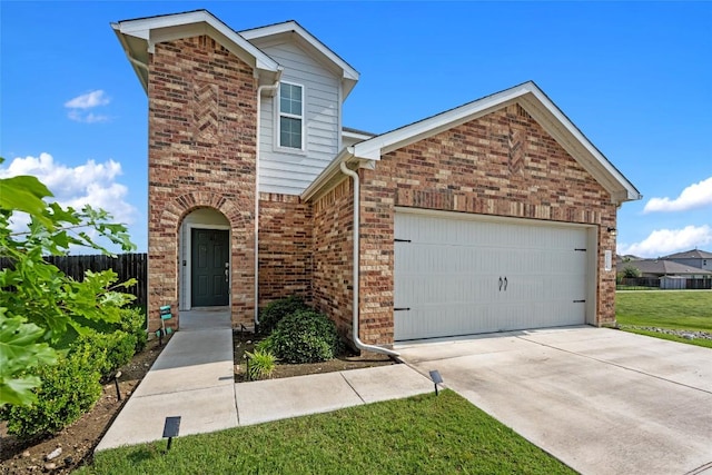 7304 Fall Ray Dr, Del Valle, TX 78617 - traditional-style home featuring an attached garage, brick siding, and concrete driveway