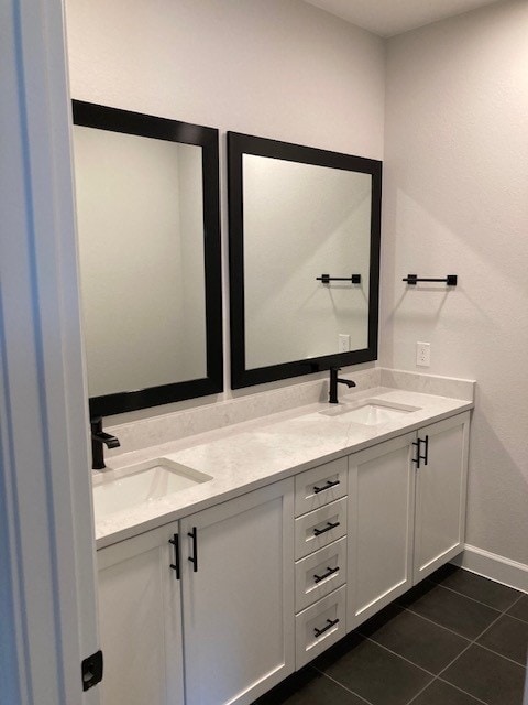 120 Prairie Clover Dr, Dripping Springs, TX 78620 - full bathroom with double vanity and tile patterned flooring