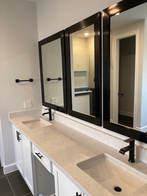 120 Prairie Clover Dr, Dripping Springs, TX 78620 - bathroom with double vanity and tile patterned flooring