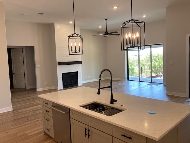 120 Prairie Clover Dr, Dripping Springs, TX 78620 - kitchen featuring open floor plan, a chandelier, stainless steel dishwasher, and recessed lighting