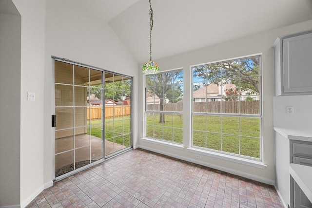 706 Cornell Dr, Pflugerville, TX 78660 - unfurnished dining area featuring baseboards and vaulted ceiling
