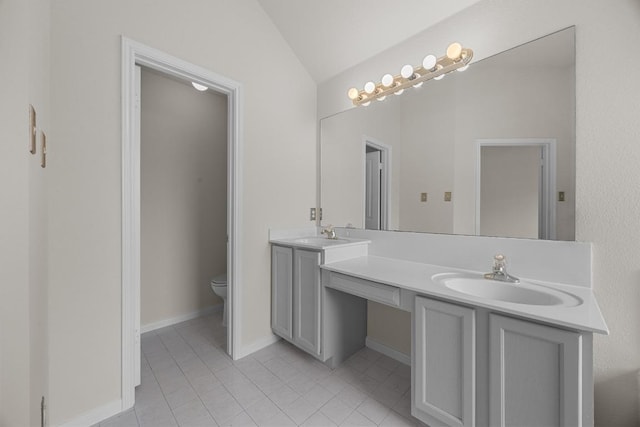 706 Cornell Dr, Pflugerville, TX 78660 - bathroom featuring vaulted ceiling, double vanity, and tile patterned flooring