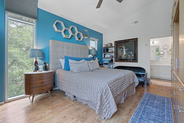 1600 Barton Springs Rd Unit 5406, Austin, TX 78704 - bedroom featuring ensuite bath, light wood-style flooring, ceiling fan, and high vaulted ceiling