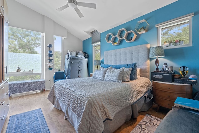 1600 Barton Springs Rd Unit 5406, Austin, TX 78704 - bedroom featuring wood finished floors, multiple windows, lofted ceiling, and a ceiling fan