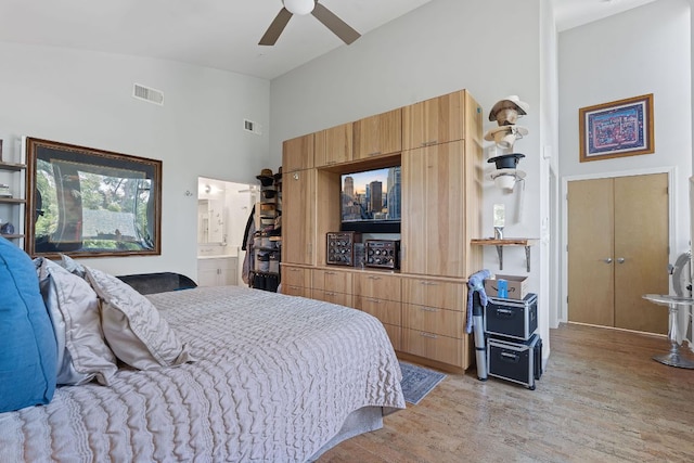 1600 Barton Springs Rd Unit 5406, Austin, TX 78704 - bedroom with a high ceiling, light wood-type flooring, a ceiling fan, and ensuite bathroom