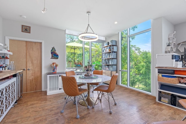 1600 Barton Springs Rd Unit 5406, Austin, TX 78704 - dining space featuring wood finished floors and expansive windows