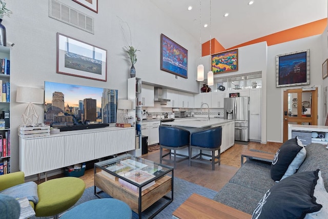 1600 Barton Springs Rd Unit 5406, Austin, TX 78704 - living area with high vaulted ceiling, dark wood-style floors, and recessed lighting