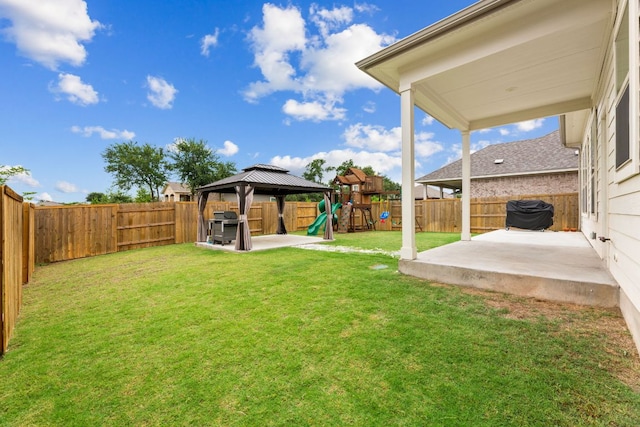 627 Cold River Run, Kyle, TX 78640 - fenced backyard featuring a patio area, a gazebo, and a playground