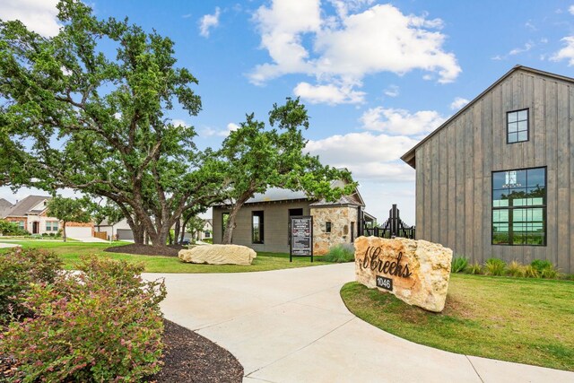 627 Cold River Run, Kyle, TX 78640 - view of property's community featuring a lawn and driveway